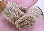 close up of white net gloves