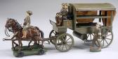 miniature metal horse-drawn ambulance with drivers